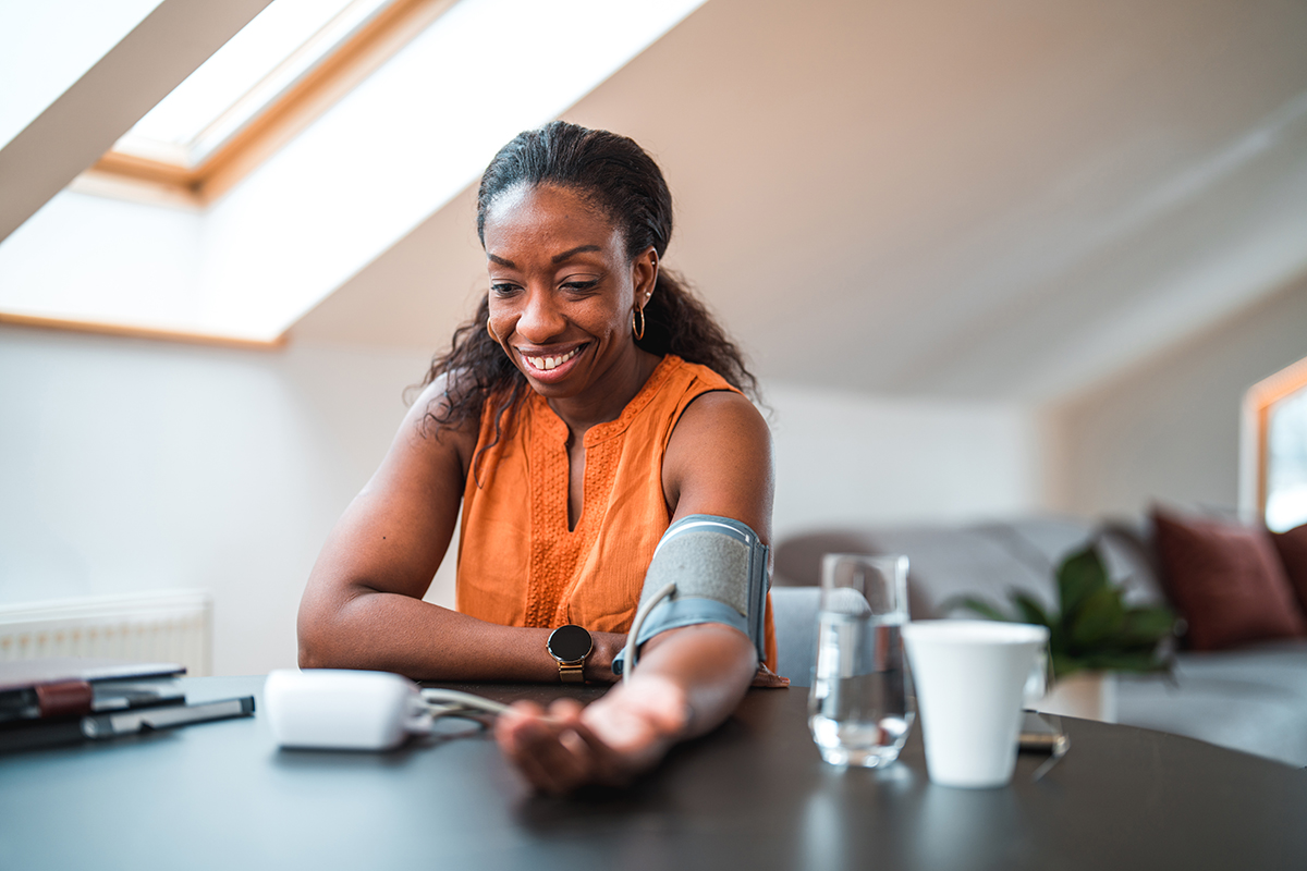 A woman taking her blood pressure