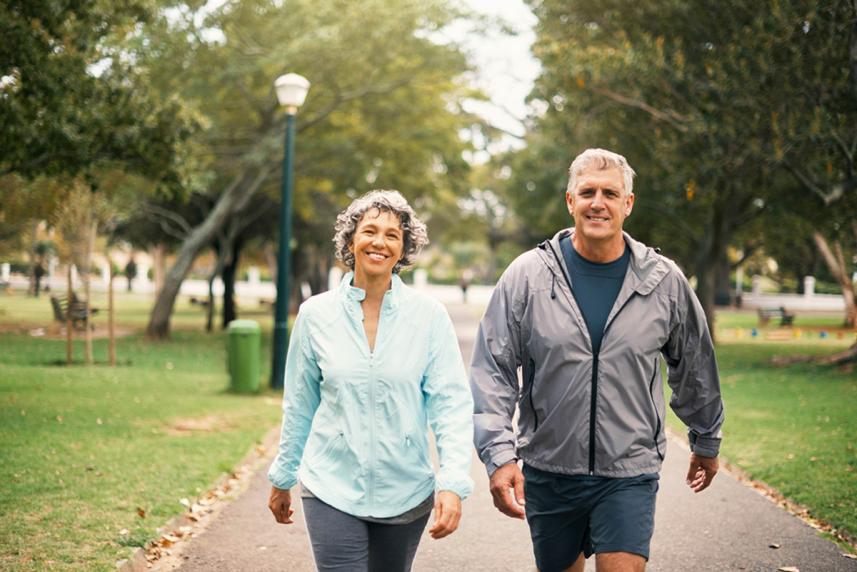 Couple walking in park together